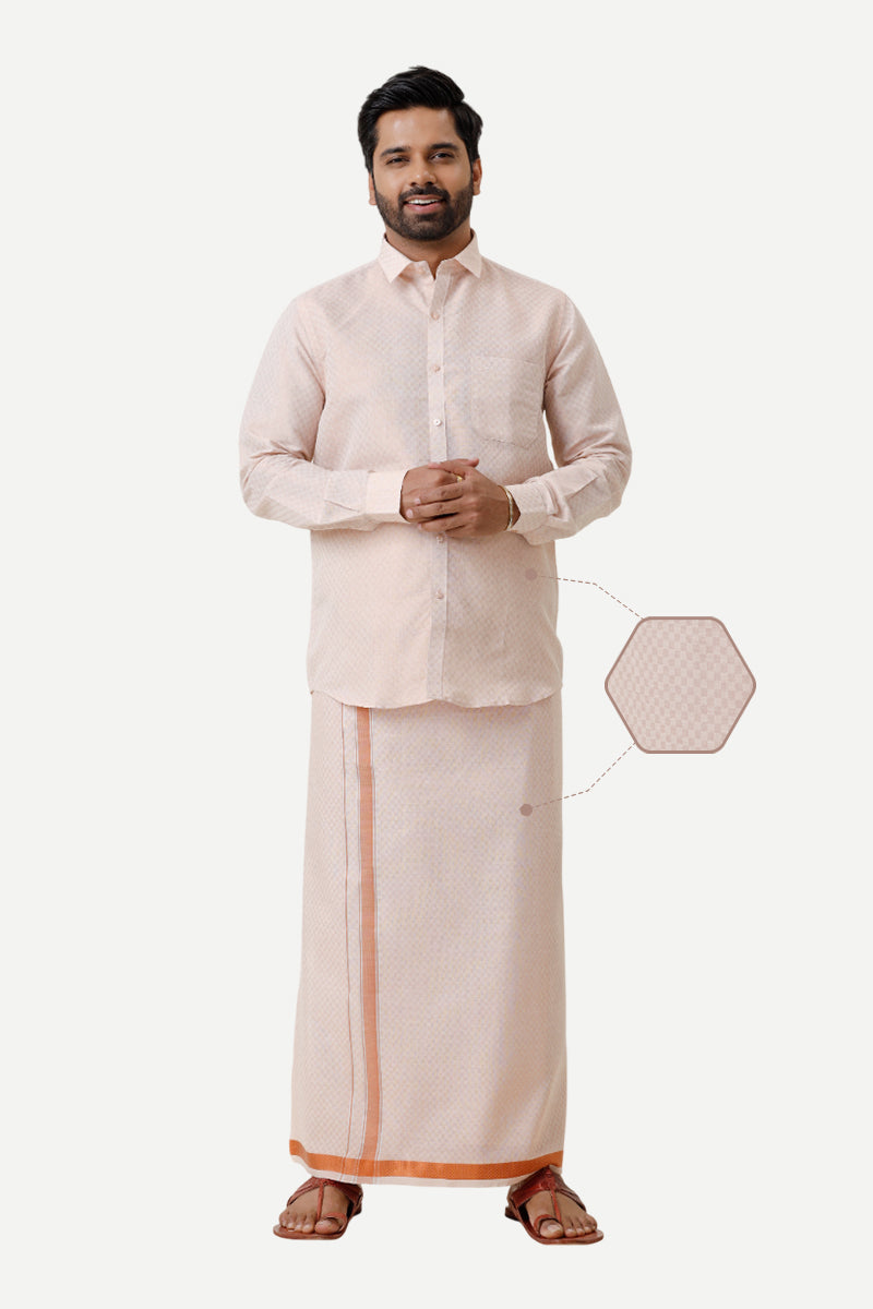 A man wearing a copper orange geometric design shirt and matching dhoti with full sleeves and a smart fit.