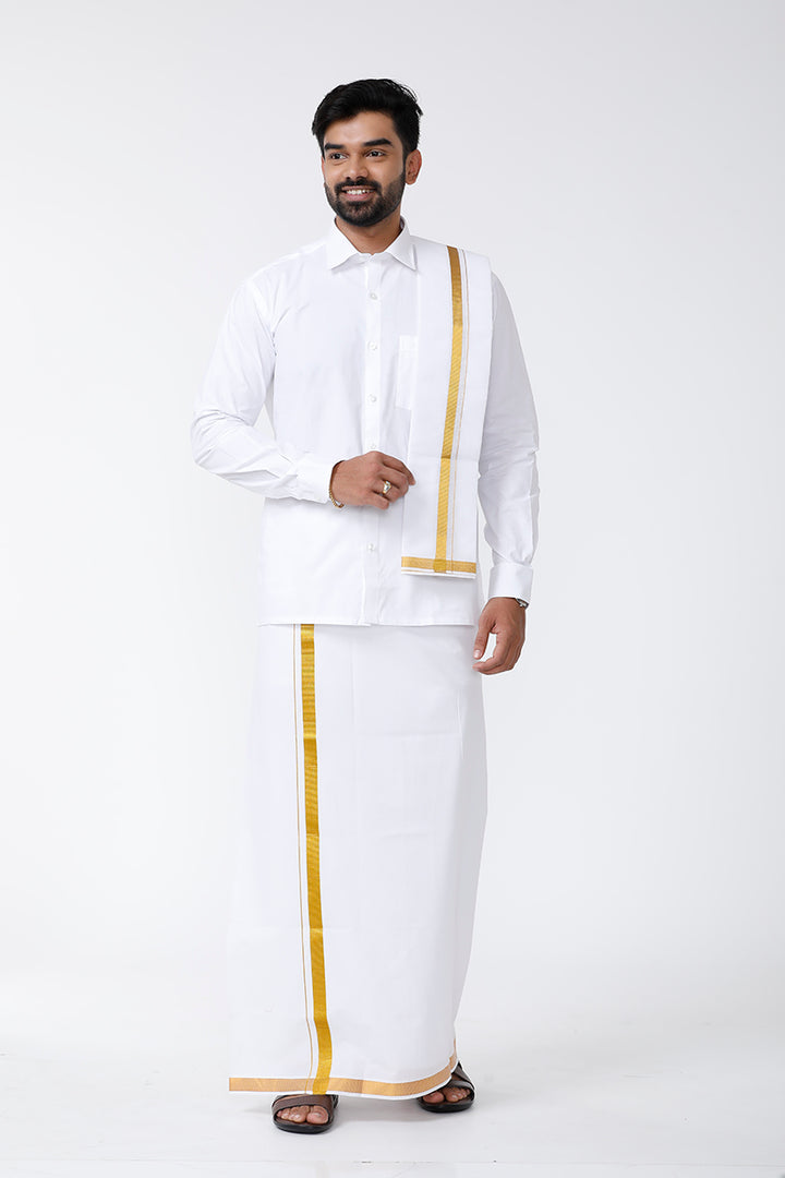 A man wearing a white shirt and a white double-layered dhoti with a white belt, along with a towel.