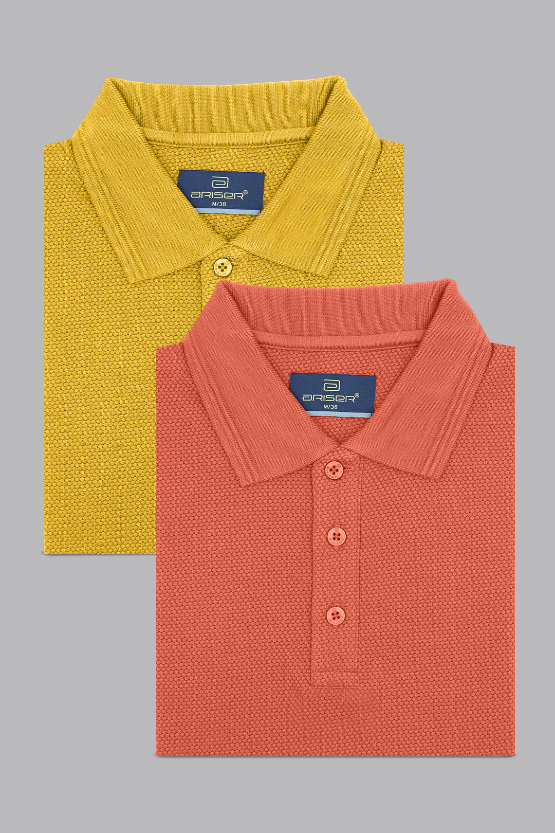 Two folded polo shirts, one yellow and one red, on a gray background.