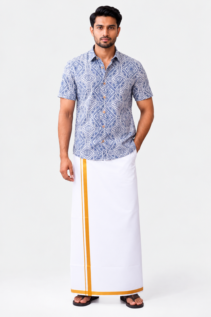 A man modeling a short-sleeve button-up shirt with a blue and white geometric pattern, paired with a white traditional wrap skirt featuring a yellow stripe, on a light gray studio background.