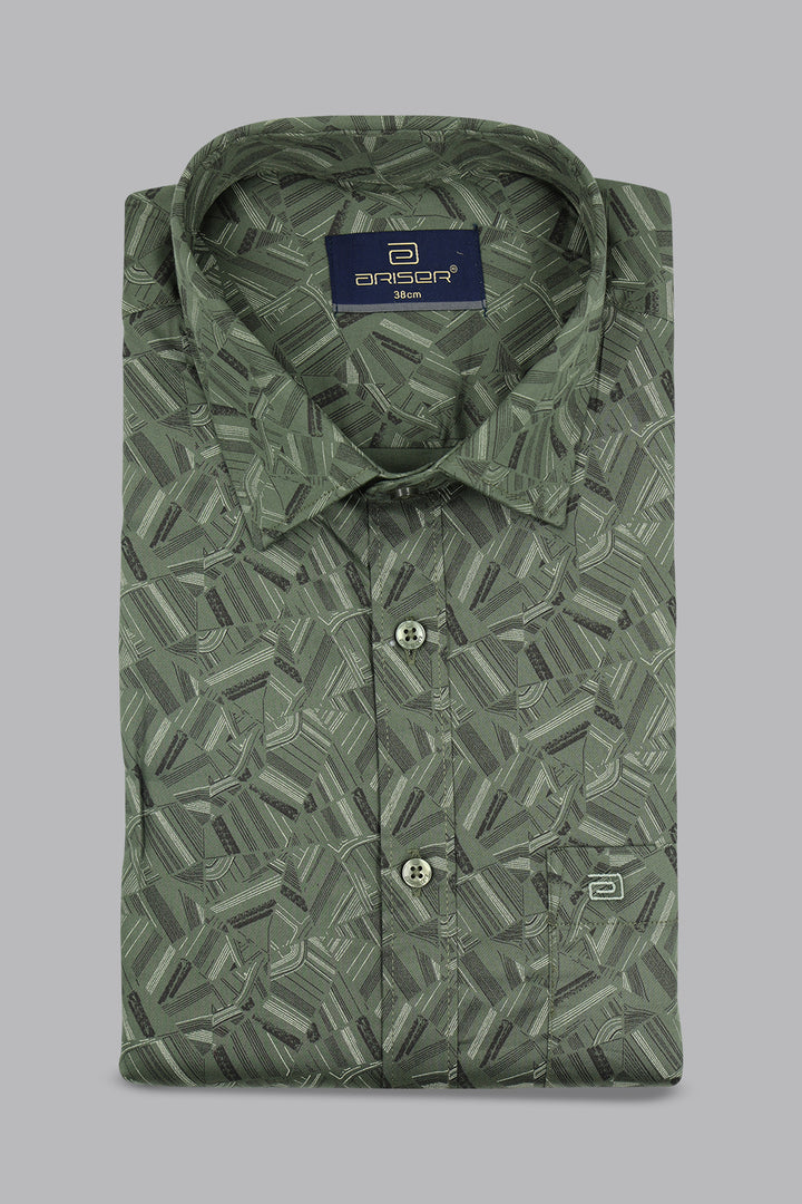 Folded green patterned shirt with a brand label on a gray background