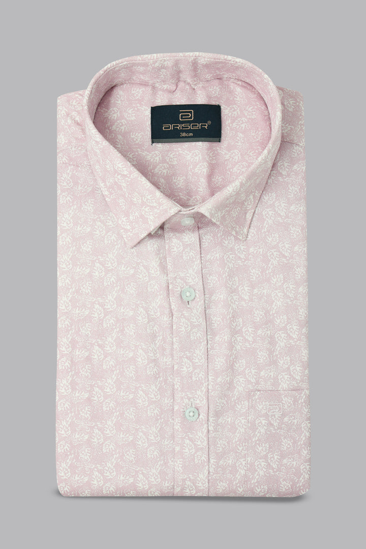 Pink patterned shirt with a brand label on a gray background