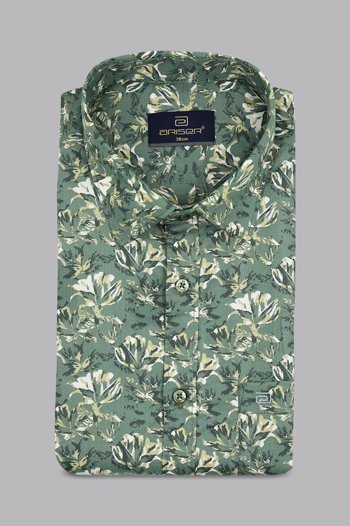 Green floral patterned shirt on a gray background