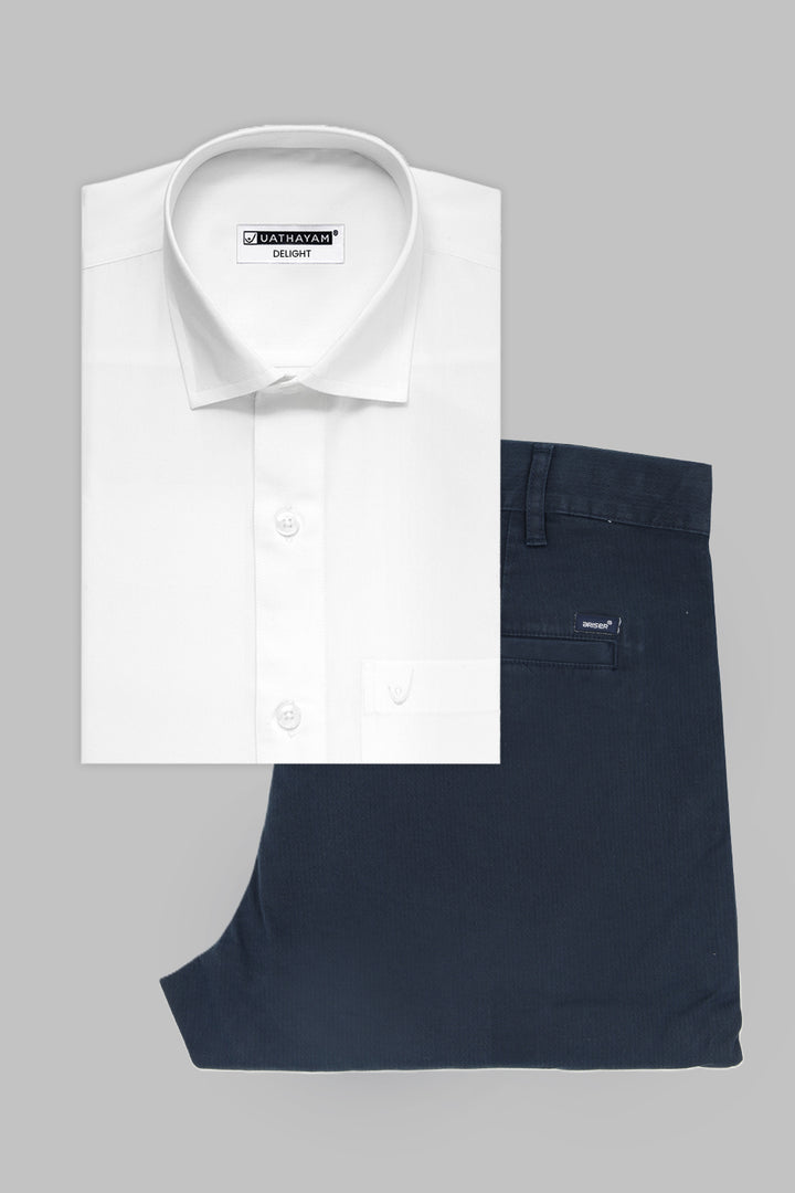 A folded white long-sleeve dress shirt with a pointed collar and a pair of folded navy blue trousers, arranged on a solid gray background.