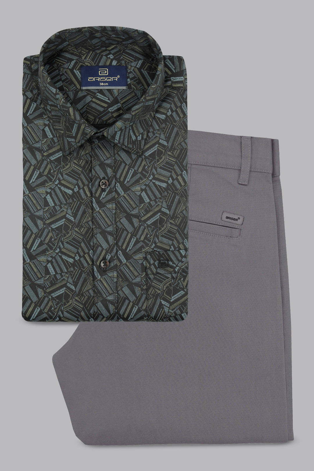 Patterned shirt and gray pants on a gray background