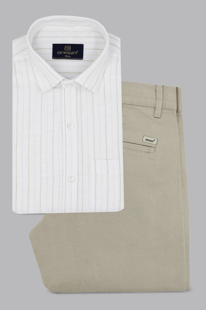 Folded white shirt and beige pants with brand labels on a gray background