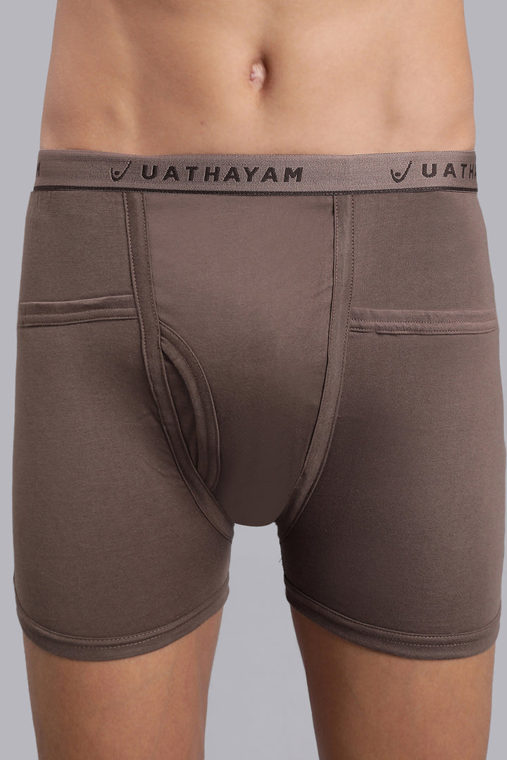 Brown boxer briefs with 'UATHAYAM' waistband on a gray background
