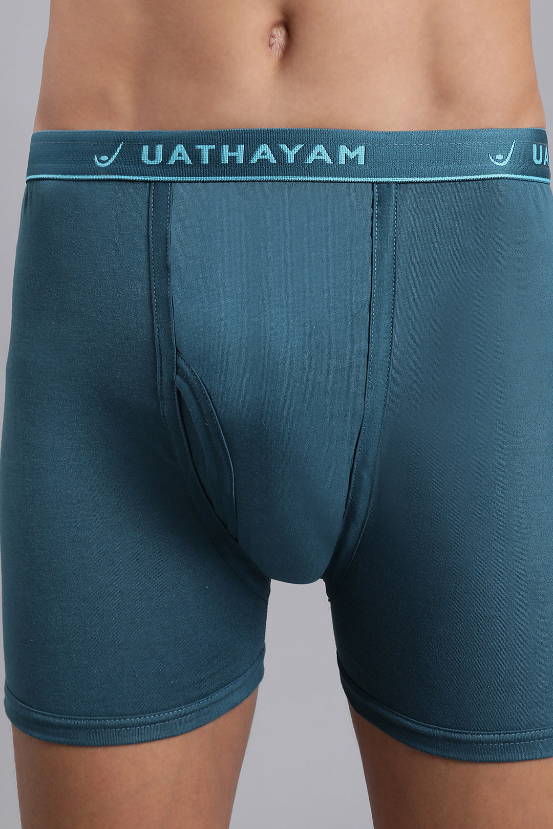 Peacock blue men’s trunks with branded outer elastic waistband