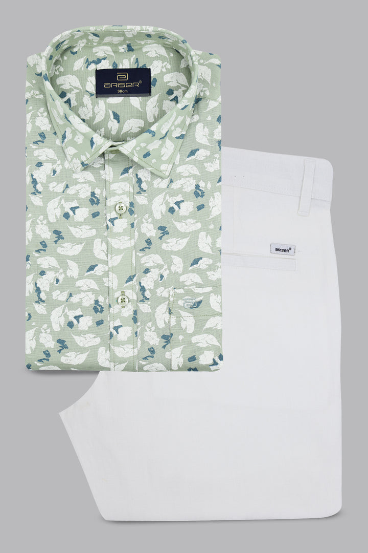 Green floral shirt and white pants with a brand label on a gray background