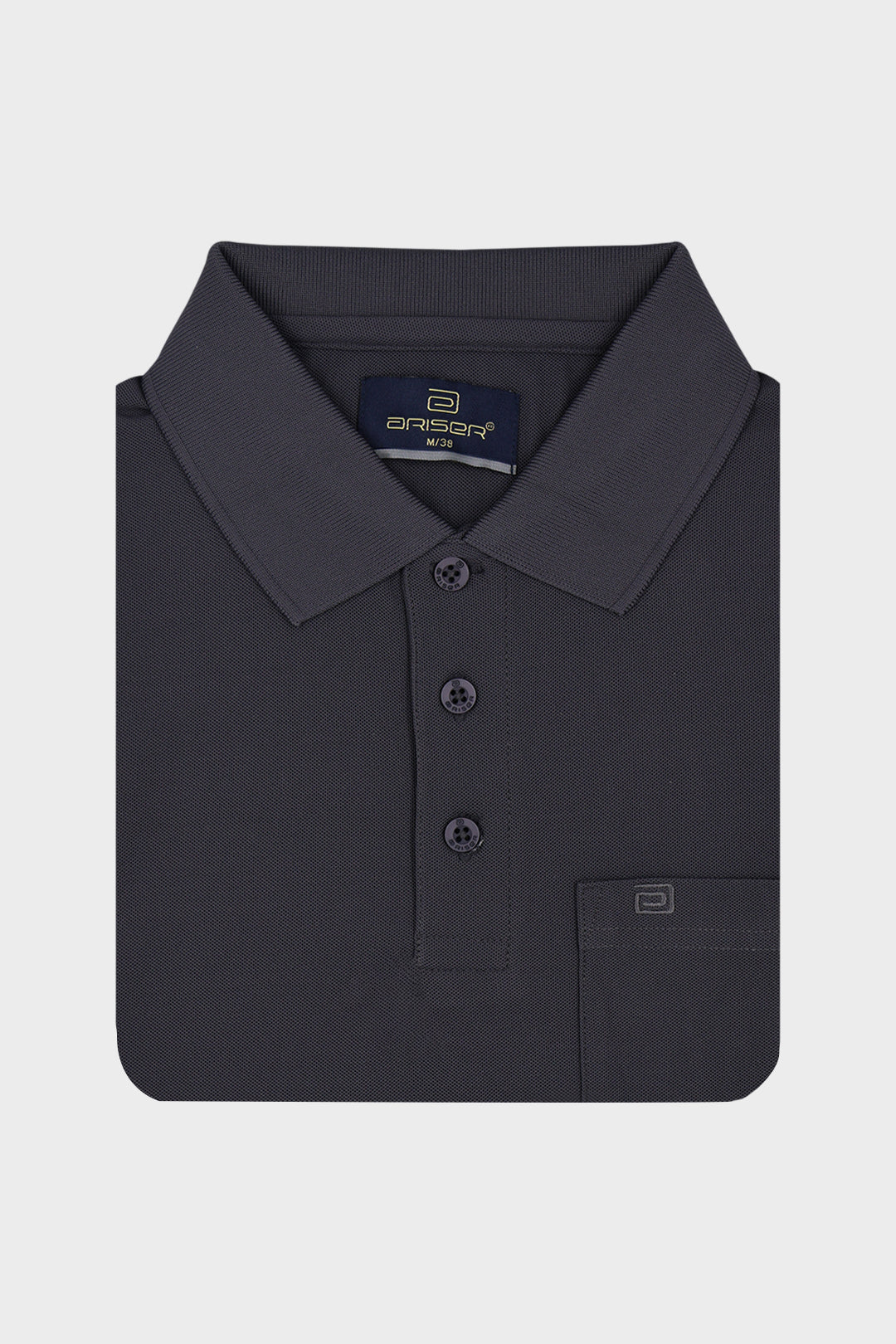 A dark charcoal gray polo T-shirt folded neatly, featuring a classic collar, three-button placket, and a left chest pocket with a small logo tab, set against a light gray background.