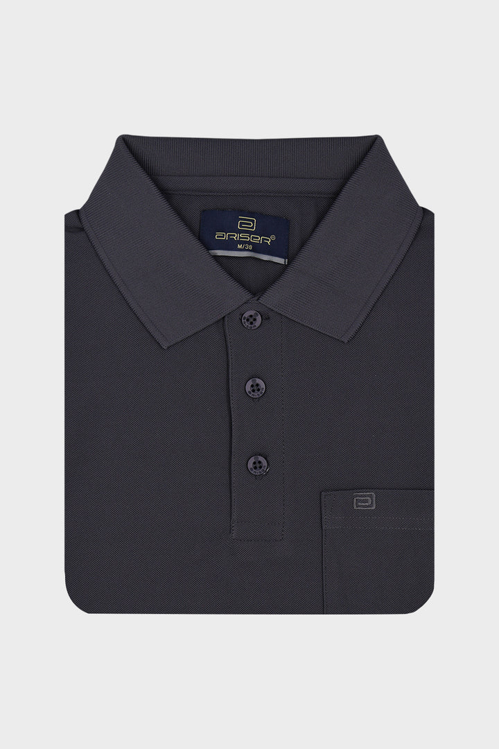 A dark charcoal gray polo T-shirt folded neatly, featuring a classic collar, three-button placket, and a left chest pocket with a small logo tab, set against a light gray background.