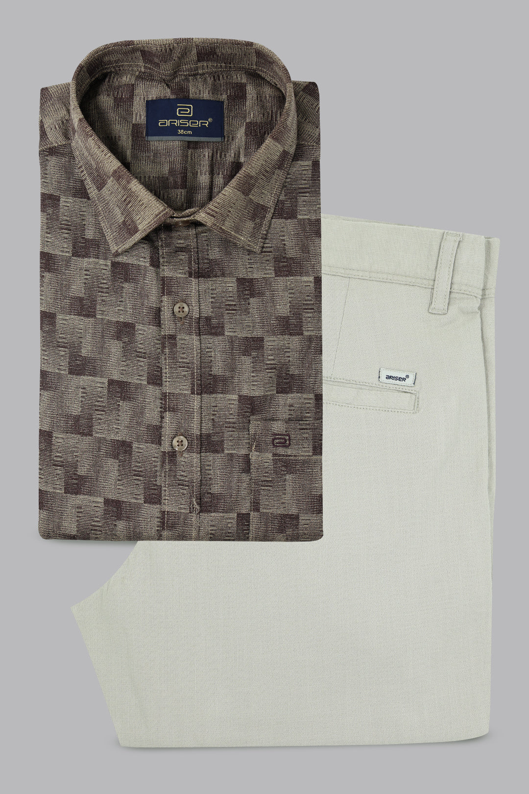 Checkered shirt and beige pants on a gray background