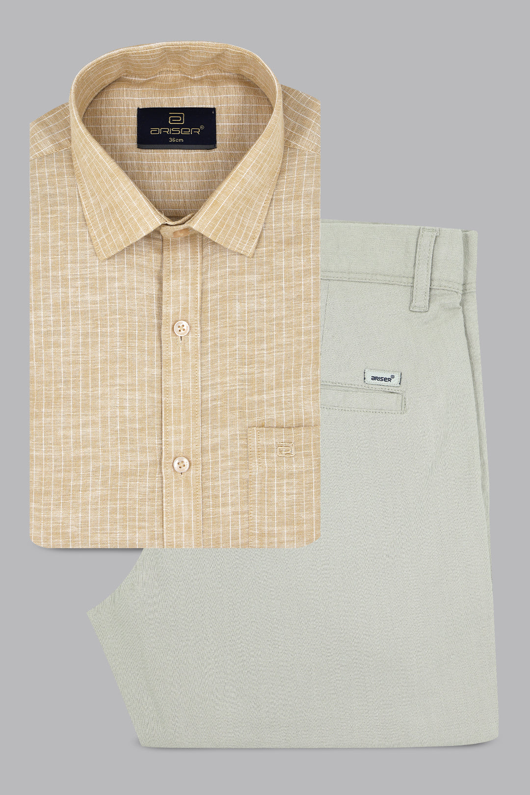 Beige checkered shirt and light green pants on a gray background