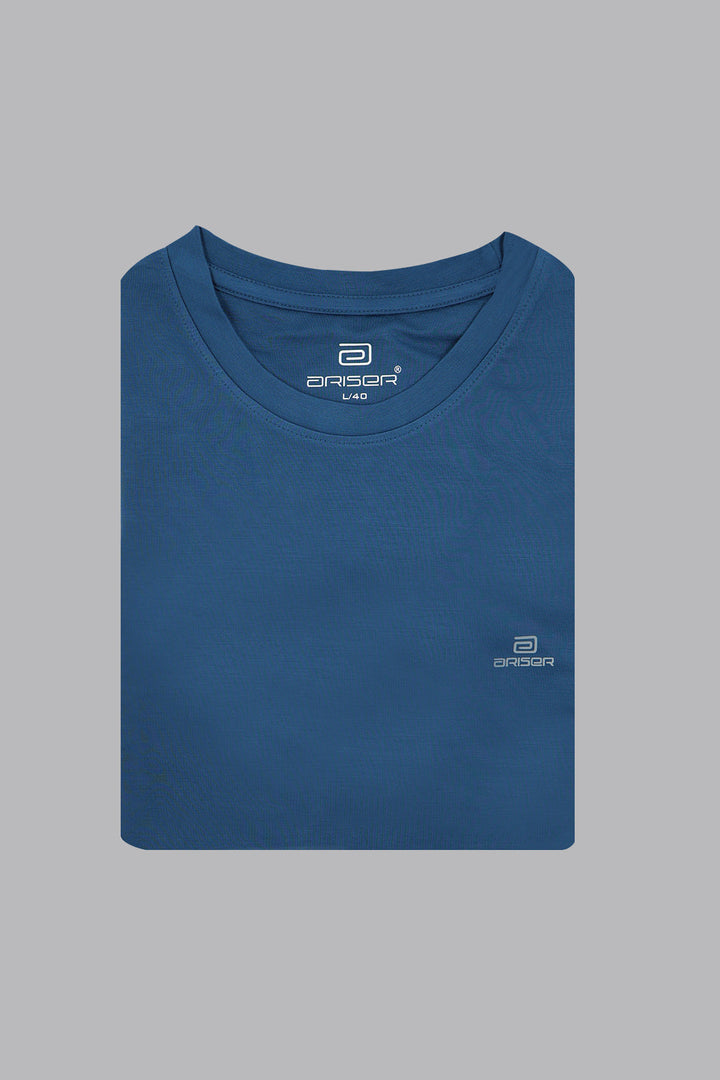 Folded blue t-shirt with a ariser brand logo on a gray background
