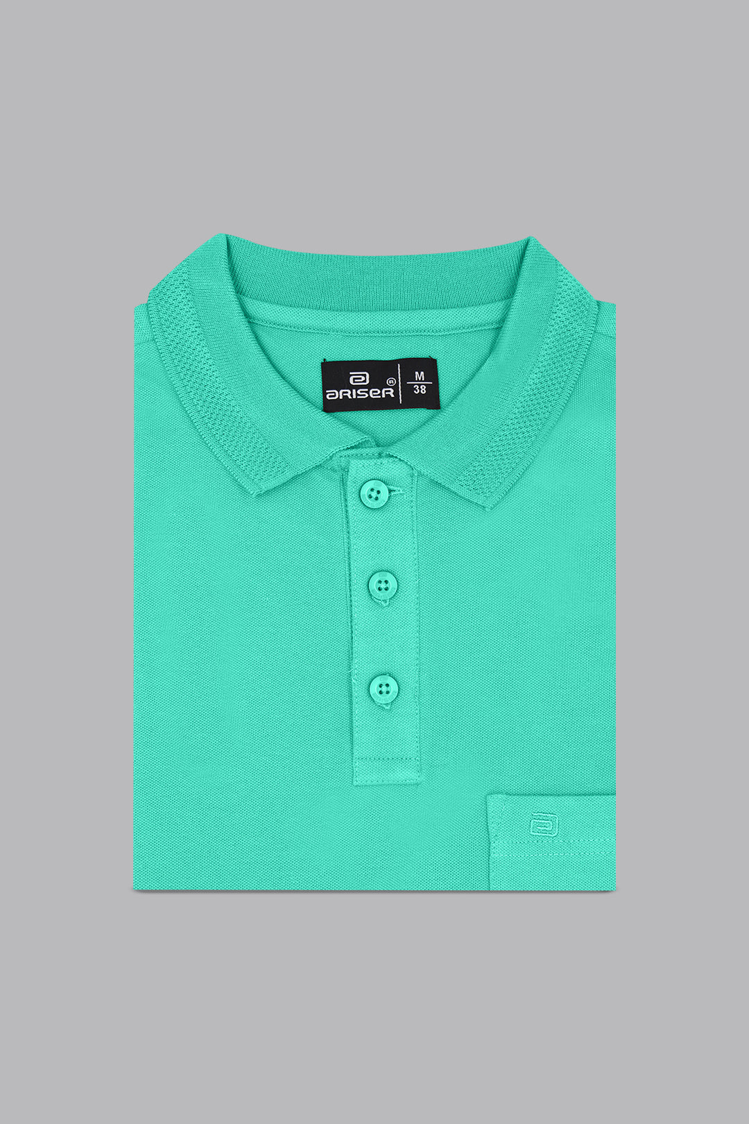 Green polo shirt with a brand label on a gray background