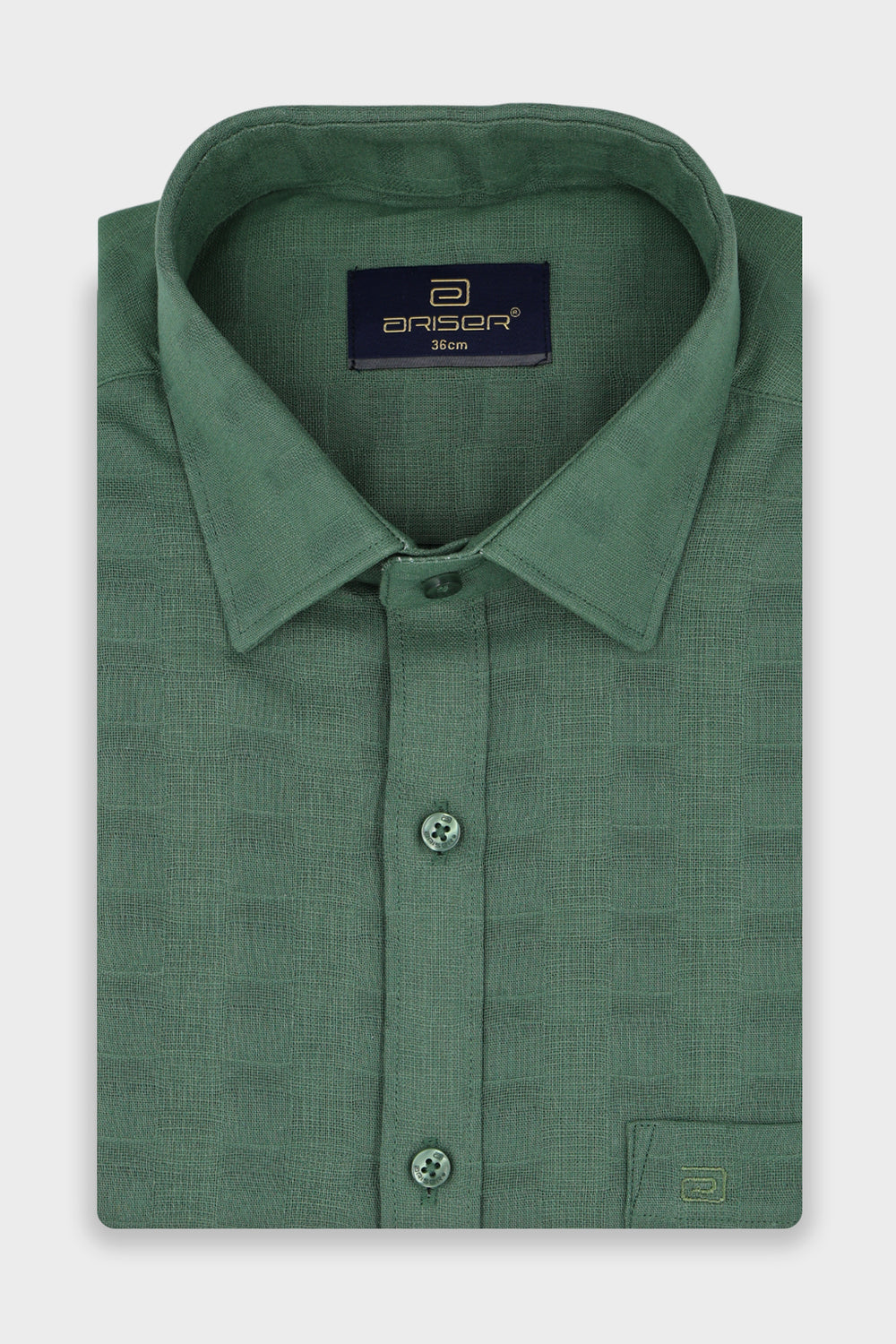 A folded green long-sleeve dress shirt with a textured pattern, featuring a pointed collar, button-down front, and a visible Ariser neck label.