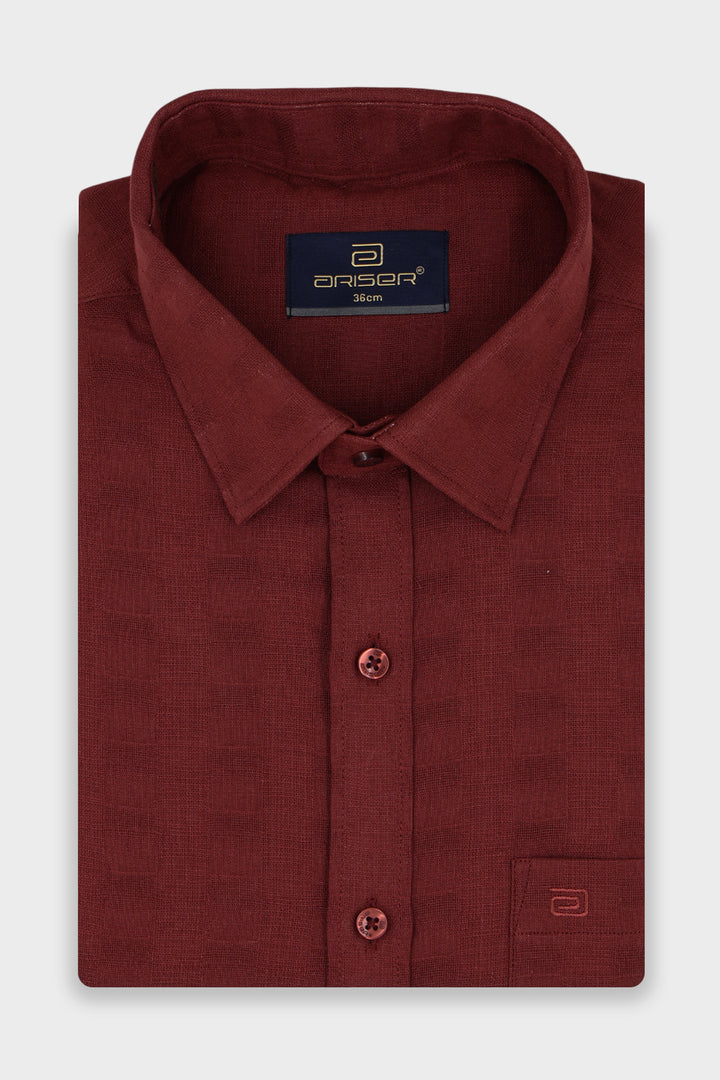 A Folded Brick Red Shirt.