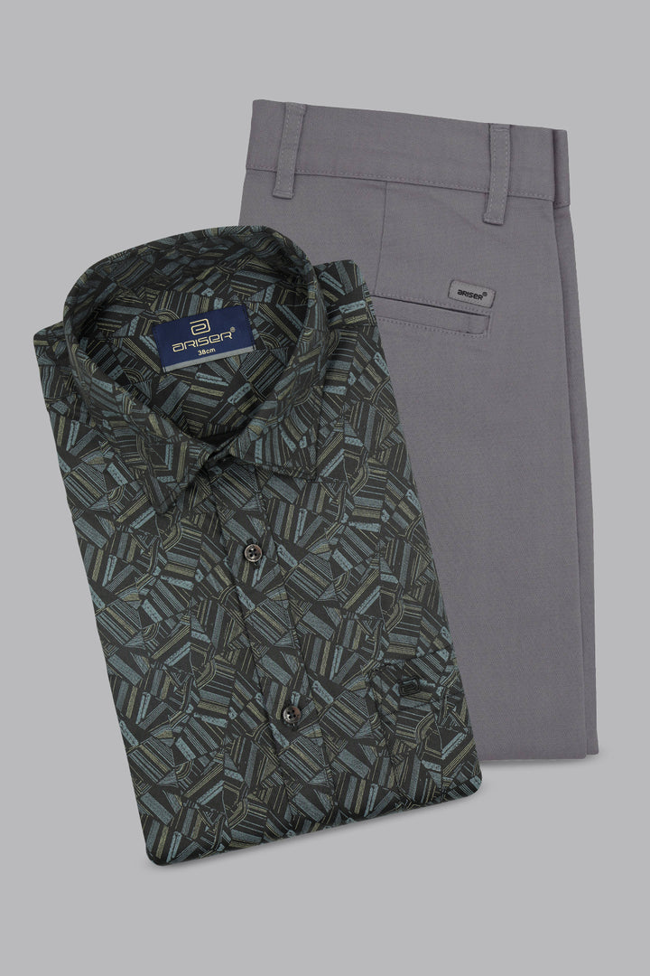 Folded patterned shirt and gray pants on a light gray background