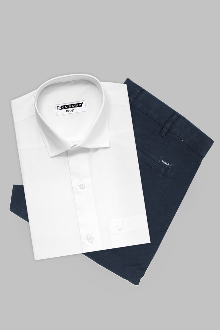A folded white dress shirt with a pointed collar and button front, layered over folded navy trousers, on a plain light gray background. 