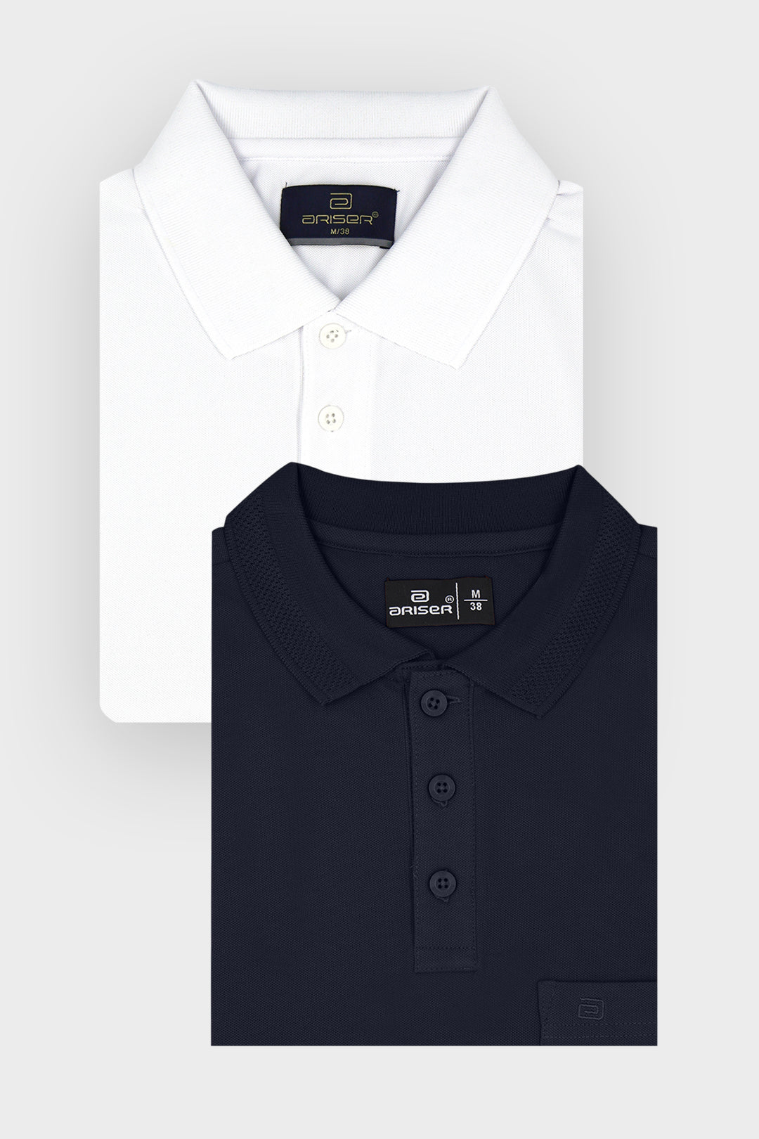 Two folded dress T-shirts from the brand Drescher, shown on a light gray background. The top shirt is white with a classic collar and three-button placket.