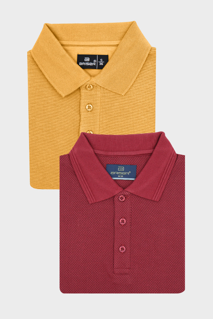 Two folded short-sleeve polo T-shirts from Ariser, one in mustard yellow and one in burgundy red, arranged on a light gray background.