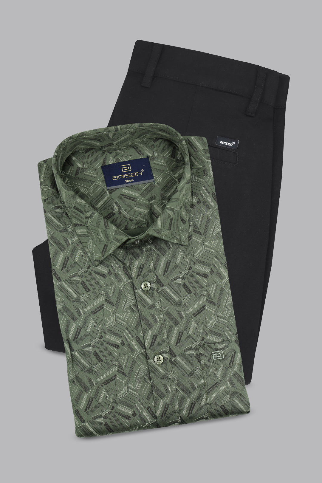 Green printed shirt and black pants with a brand label on a gray background