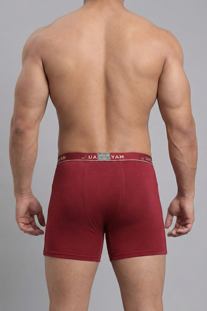Red boxer briefs with a brand logo on a gray background