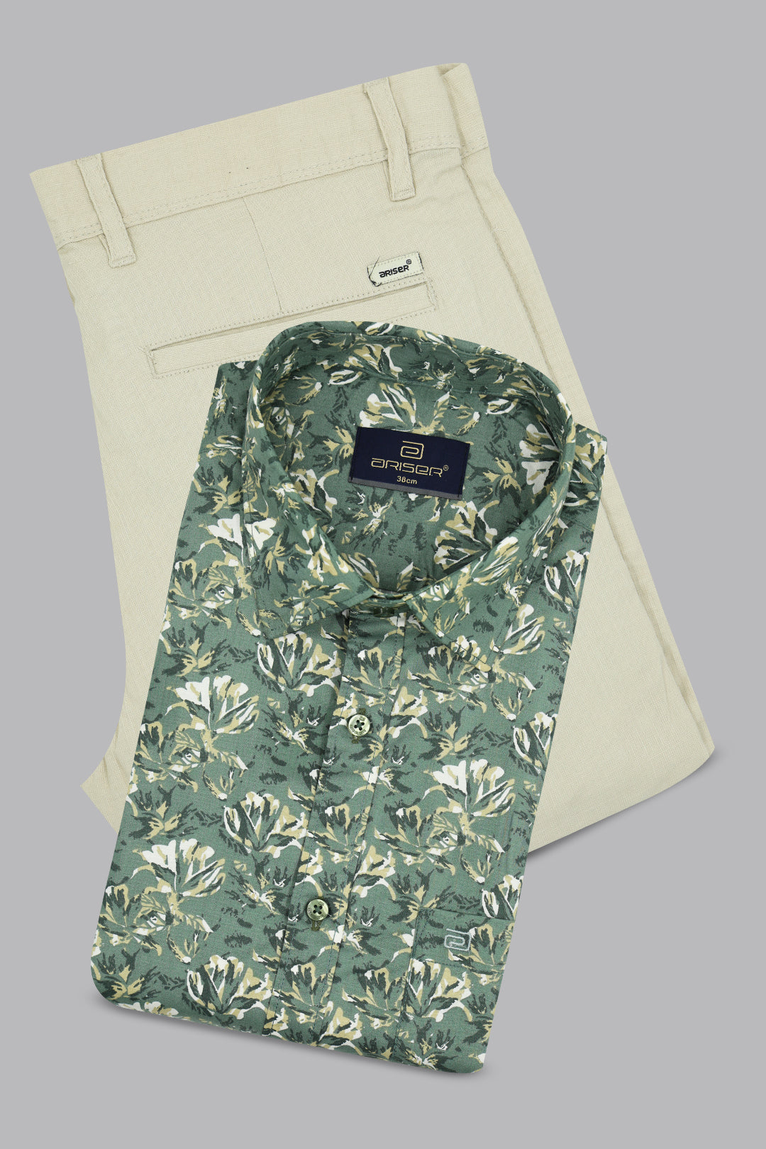 Men’s dusty olive green printed shirt paired with elegant cream trousers