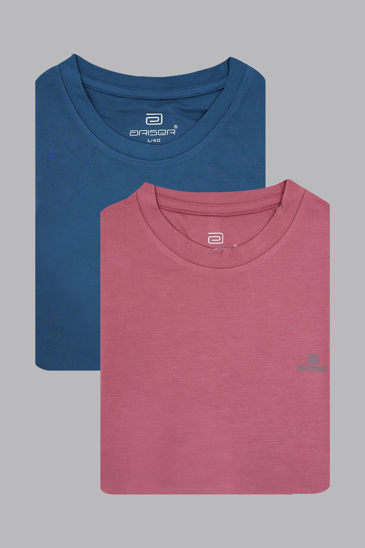 Two folded t-shirts, one blue and one pink, on a gray background.
