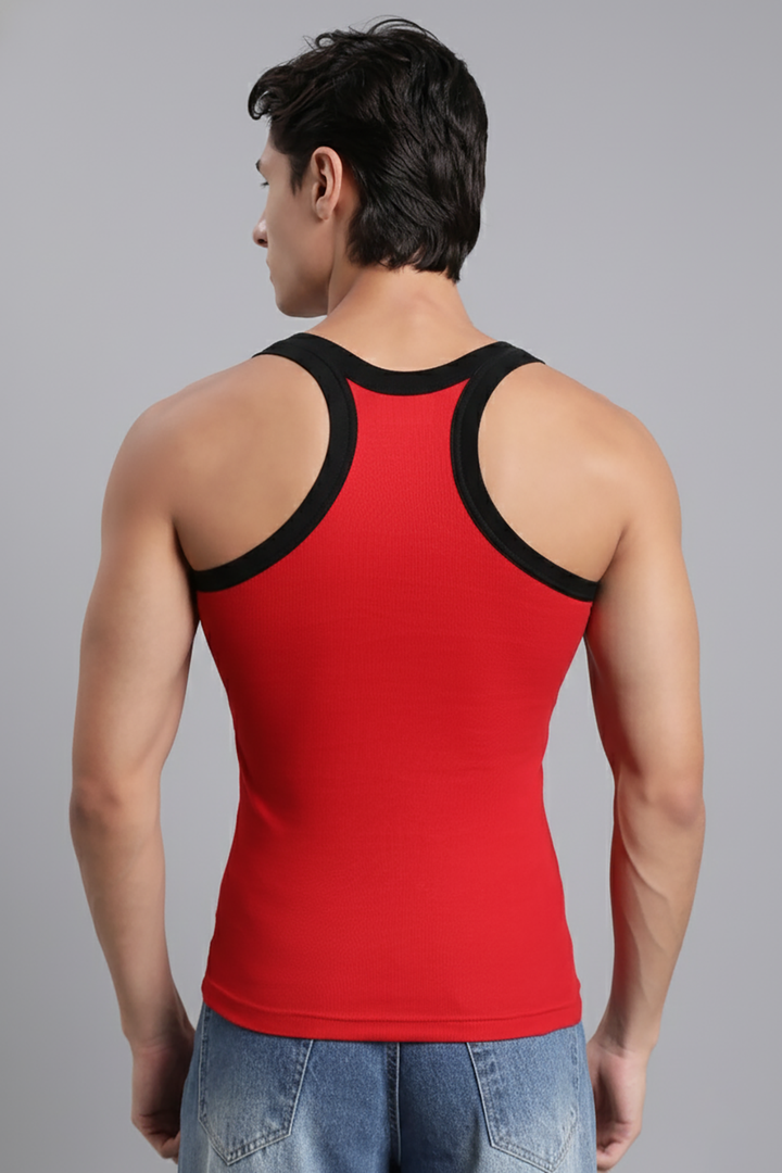 Red tank top with black straps worn by a person on a gray background