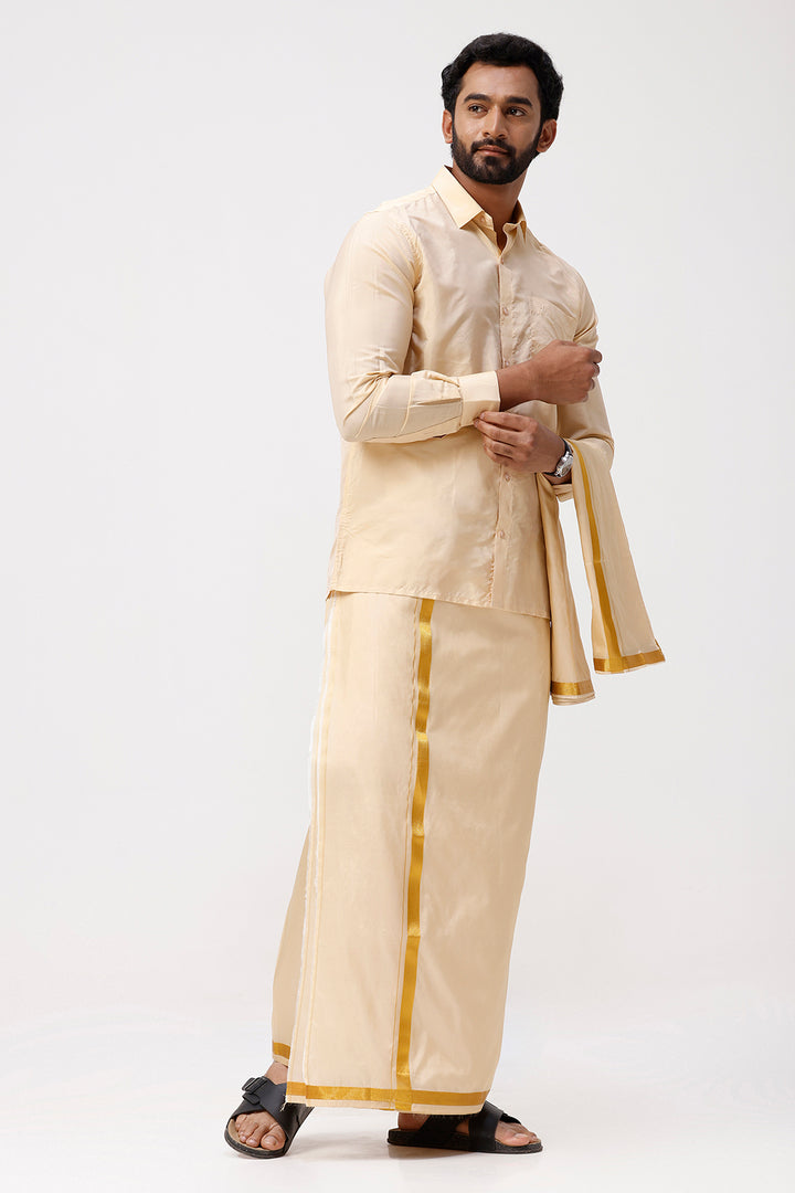 Man wearing a traditional cream shirt  with gold accents on a white background