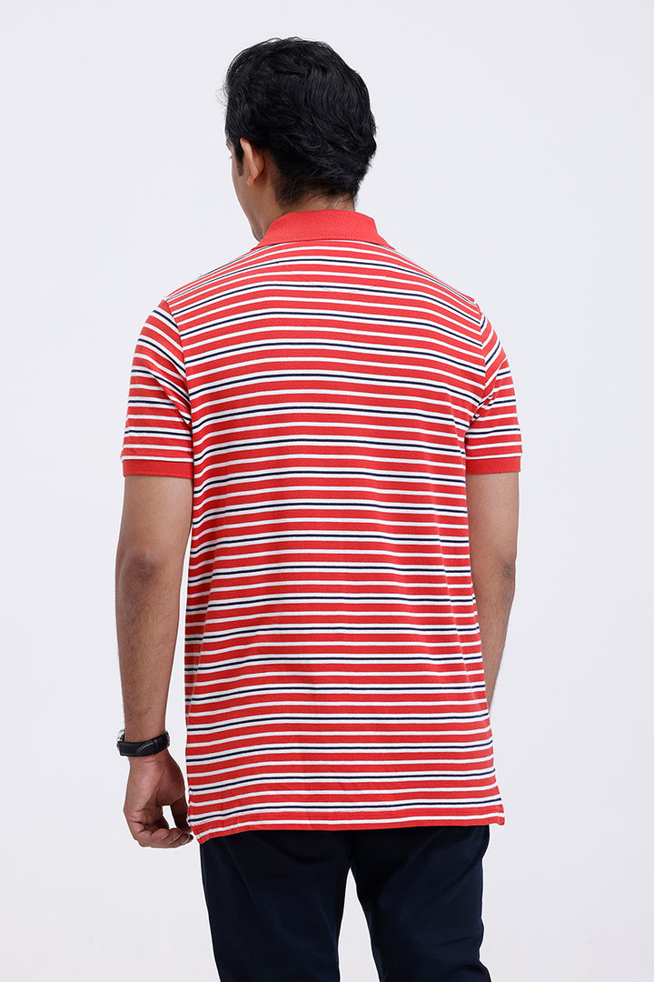 Man wearing a red and white striped polo shirt on a white background
