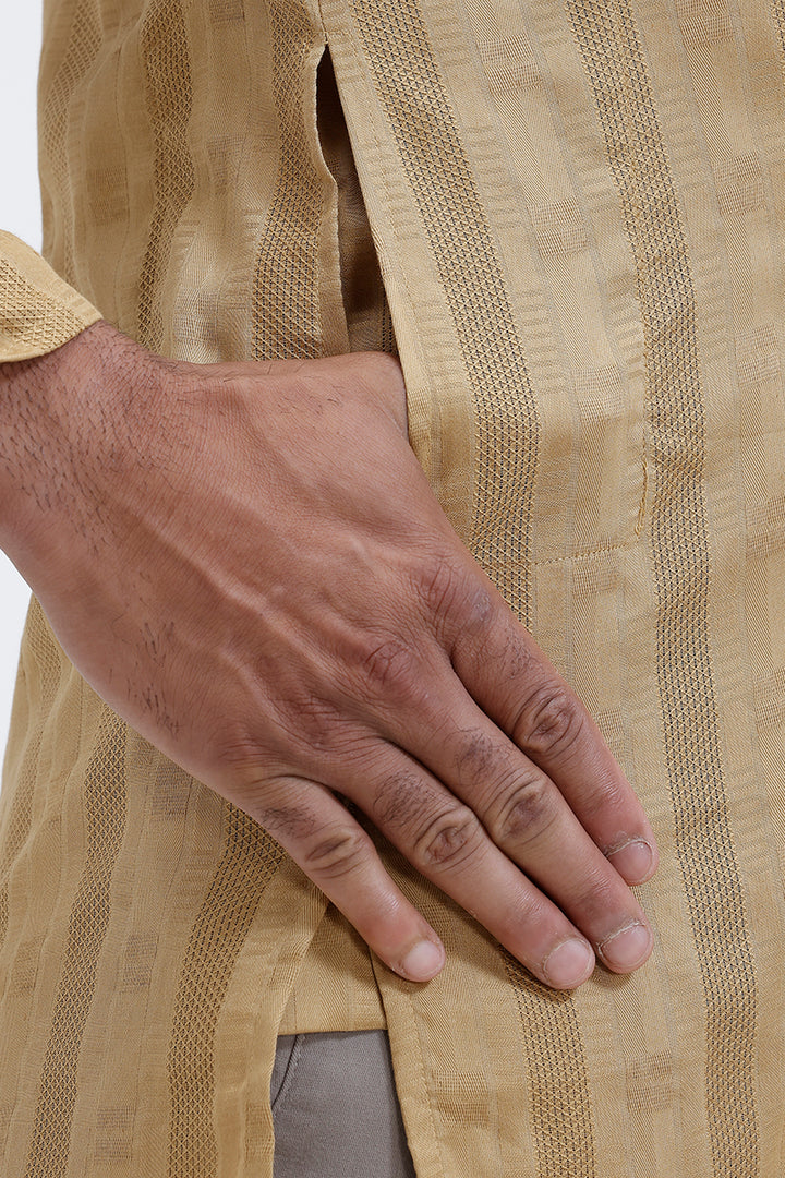Close-up of a hand on a yellow textured fabric