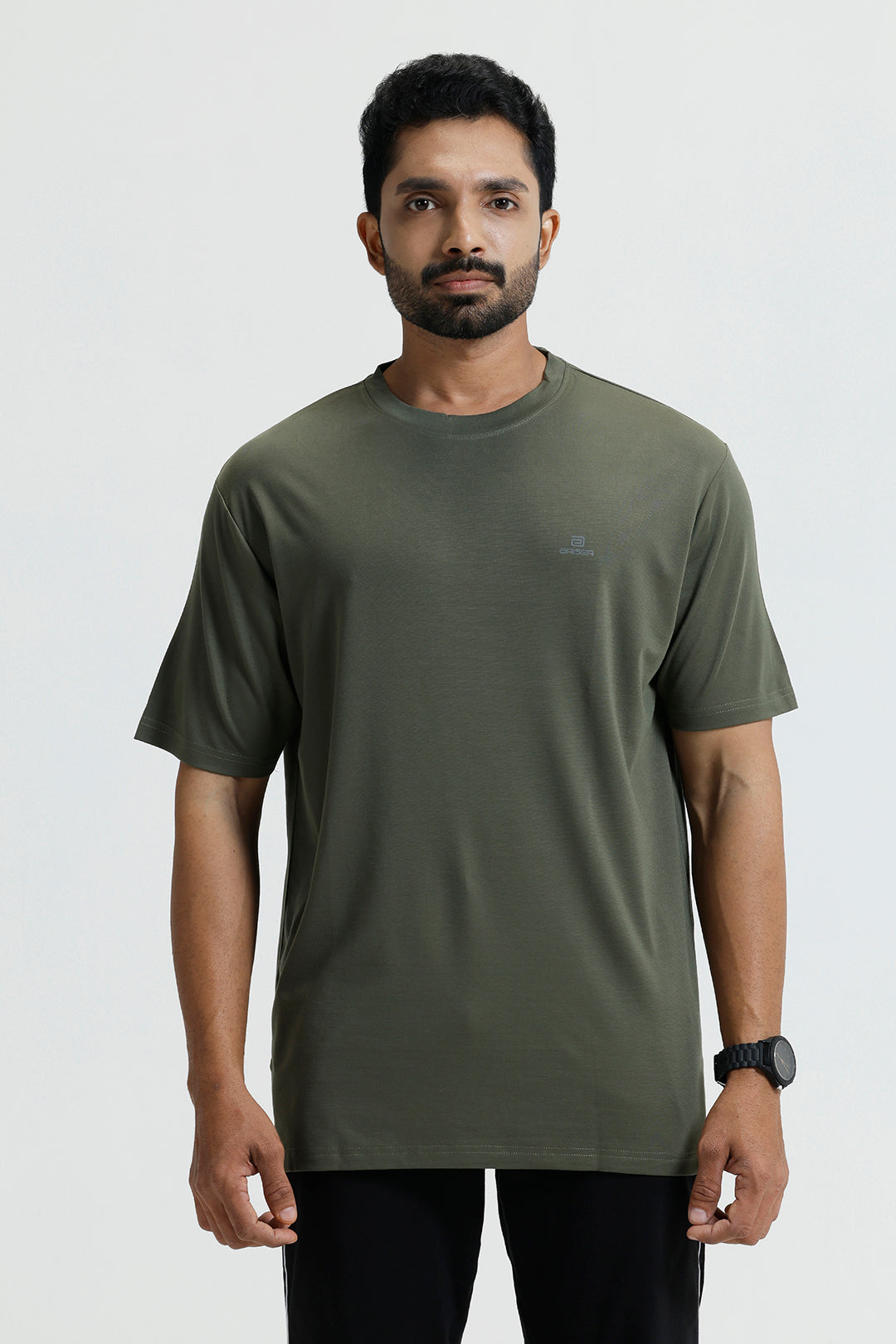 Man wearing an olive green t-shirt on a white background