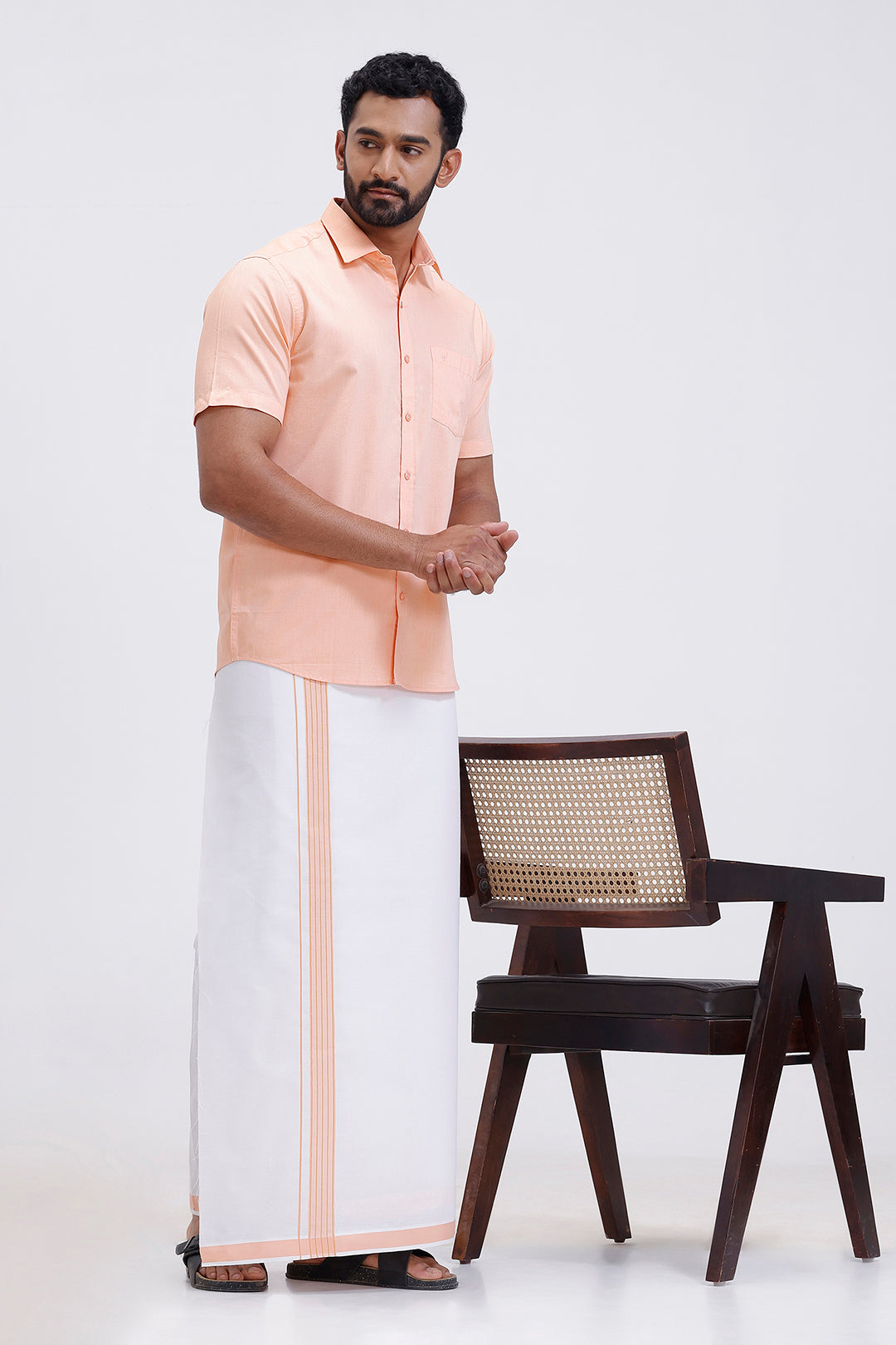 South Indian traditional wear orange shirt and fancy border dhoti