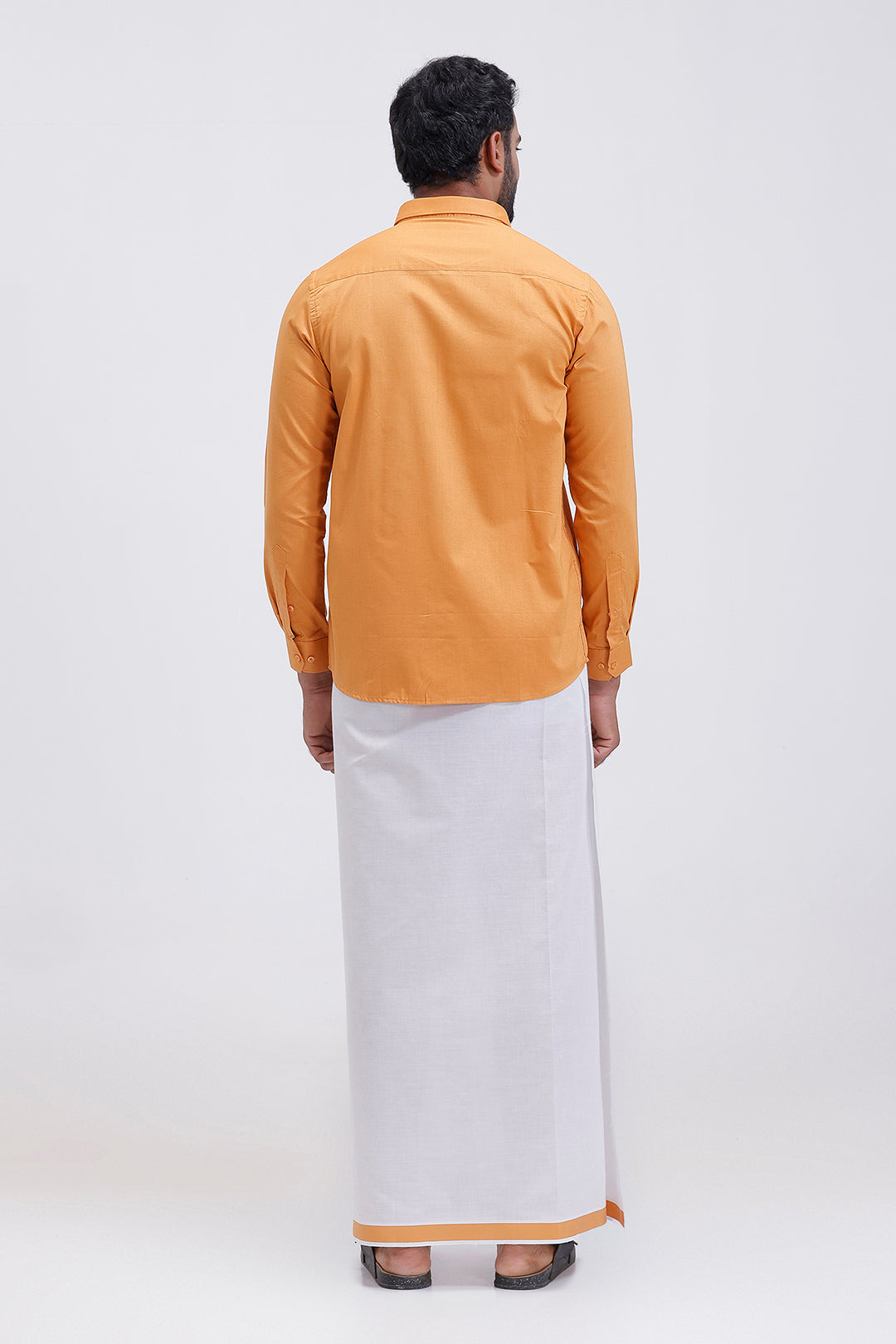 South Indian traditional wear mustard gold shirt and fancy border dhoti