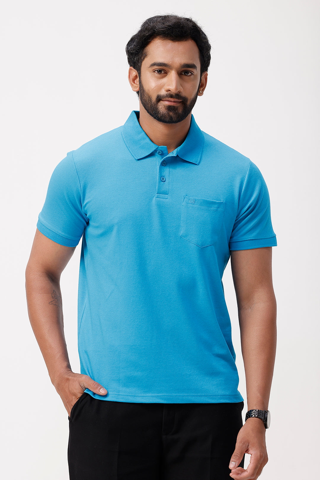 Man wearing a blue polo shirt on a white background